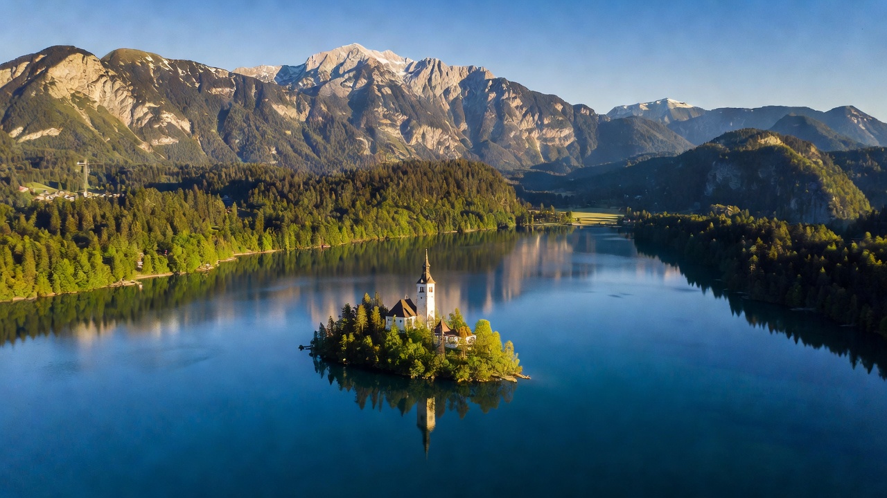 Aerial perspective of Lake Bled surrounded by Julian Alps
